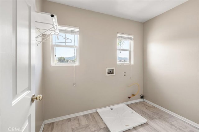 33010 Poppy St, Temecula, CA 92592 - laundry room featuring gas dryer hookup, light wood finished floors, washer hookup, and baseboards
