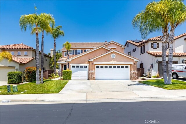 33010 Poppy St, Temecula, CA 92592 - view of front facade with an attached garage, driveway, stucco siding, a front yard, and a residential view