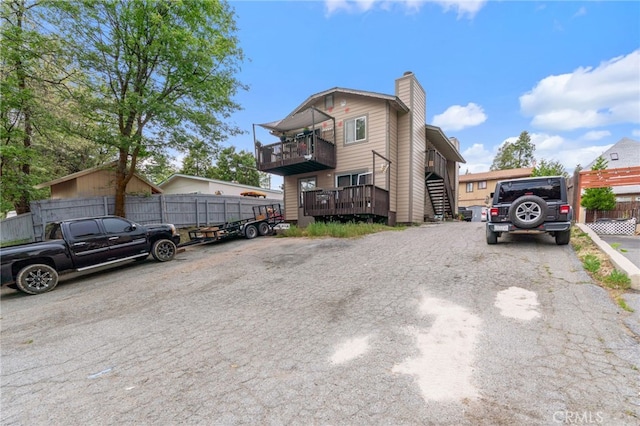26166 Alpine Ln, Twin Peaks, CA 92391 - view of front of home with a chimney and a balcony