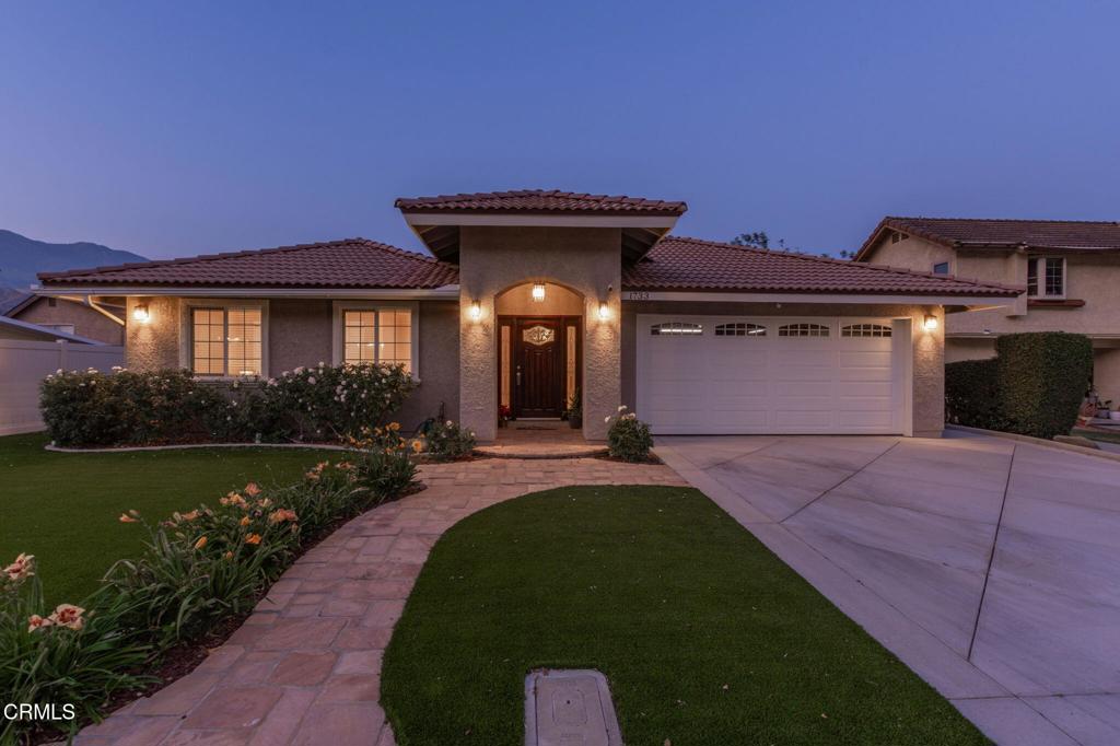 1733 Cherry Hill Rd, Santa Paula, CA 93060 - mediterranean / spanish house with stucco siding, a garage, and a tiled roof
