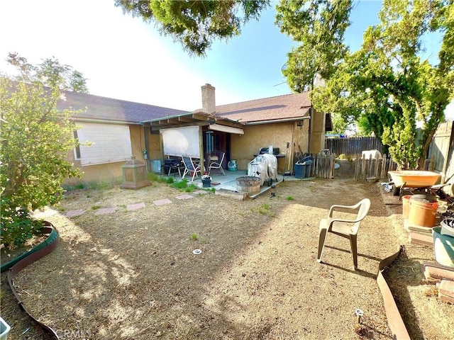 11230 Reliance Dr, Riverside, CA 92505 - back of property featuring a patio, a chimney, and stucco siding