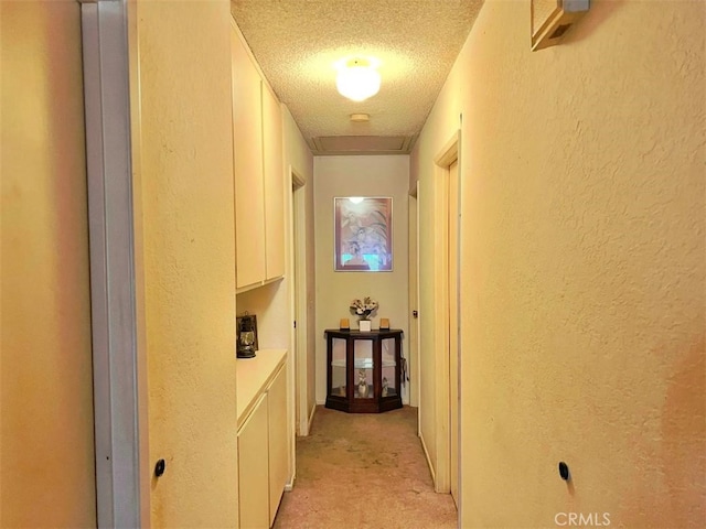 11230 Reliance Dr, Riverside, CA 92505 - hall with a textured ceiling, a textured wall, and light colored carpet