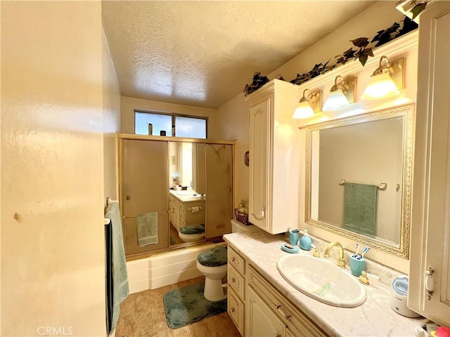 11230 Reliance Dr, Riverside, CA 92505 - full bathroom with a textured ceiling, vanity, toilet, and enclosed tub / shower combo