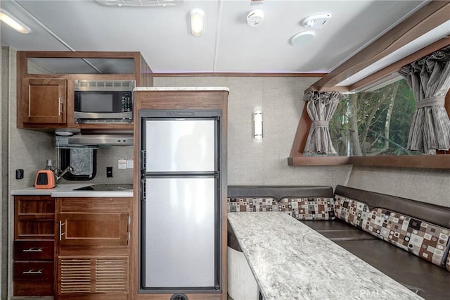 3076 Wauneta St, Newbury Park, CA 91320 - kitchen featuring stainless steel appliances, light countertops, range hood, and backsplash