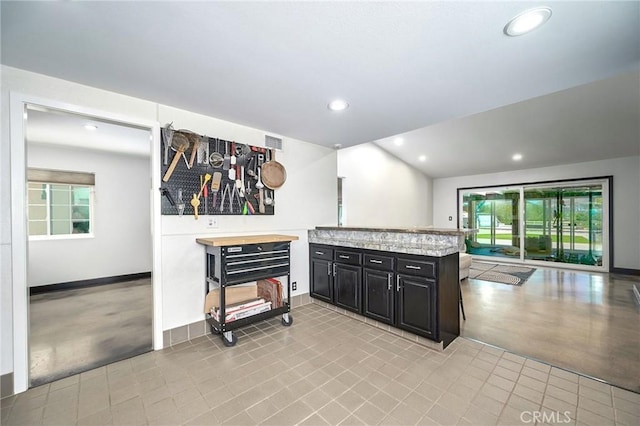 3076 Wauneta St, Newbury Park, CA 91320 - kitchen with dark cabinetry, light countertops, recessed lighting, a peninsula, and baseboards