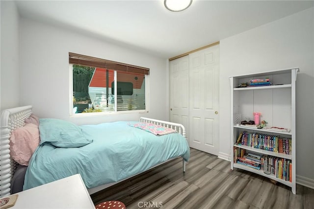 3076 Wauneta St, Newbury Park, CA 91320 - bedroom with wood finished floors, a closet, and baseboards