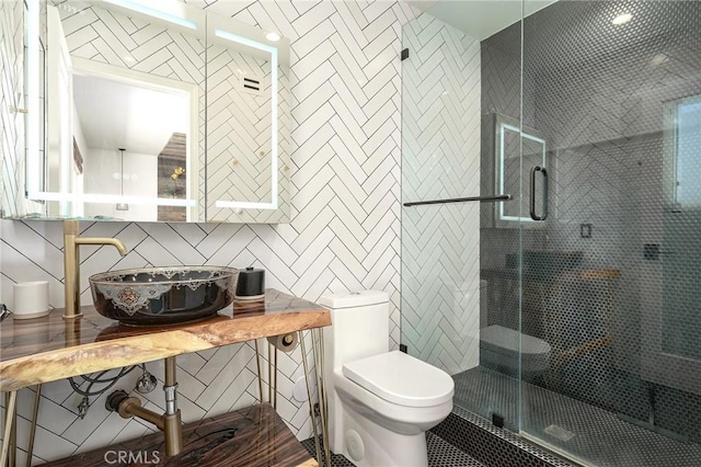 3076 Wauneta St, Newbury Park, CA 91320 - bathroom featuring toilet, a stall shower, a sink, and backsplash