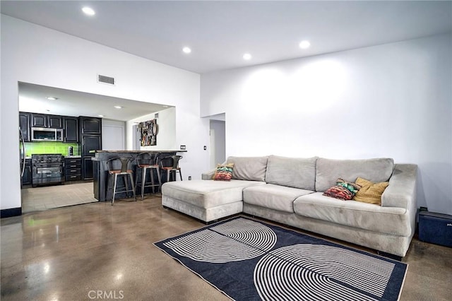 3076 Wauneta St, Newbury Park, CA 91320 - living area with bar area, recessed lighting, and finished concrete flooring