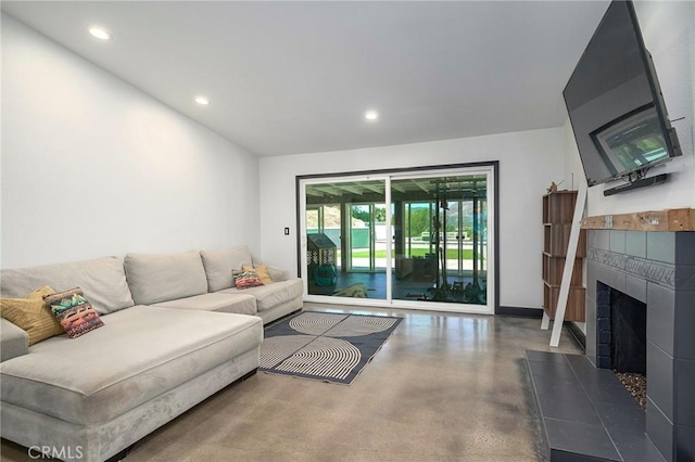 3076 Wauneta St, Newbury Park, CA 91320 - living room with finished concrete floors, recessed lighting, a fireplace, and baseboards