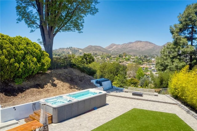 3076 Wauneta St, Newbury Park, CA 91320 - view of yard featuring a hot tub, a patio, and a mountain view