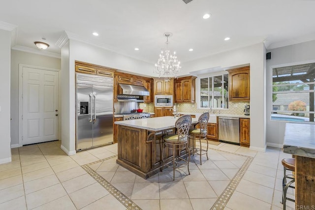 1508 Sequoia Ln, Vista, CA 92081 - kitchen featuring built in appliances, exhaust hood, light countertops, decorative backsplash, and recessed lighting