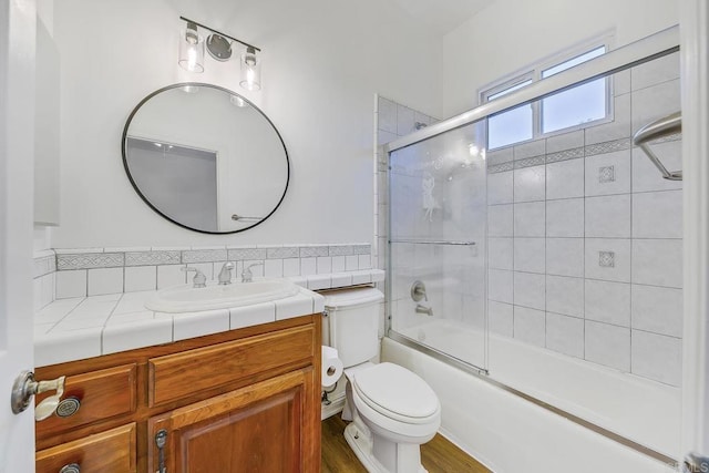 1508 Sequoia Ln, Vista, CA 92081 - bathroom with vanity, toilet, shower / bath combination with glass door, and wood finished floors