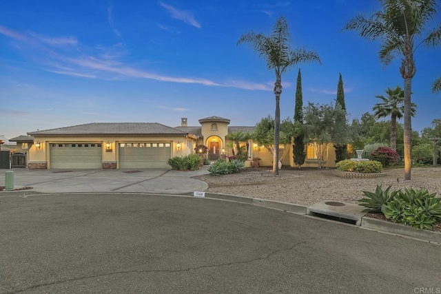 1508 Sequoia Ln, Vista, CA 92081 - mediterranean / spanish-style home featuring stucco siding, a garage, and driveway