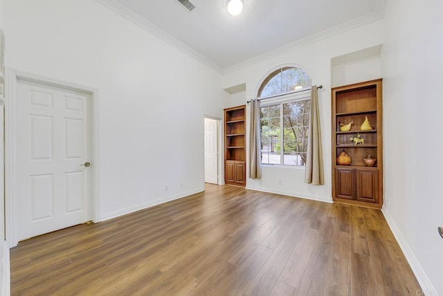 1508 Sequoia Ln, Vista, CA 92081 - unfurnished room with wood finished floors, crown molding, baseboards, and a towering ceiling