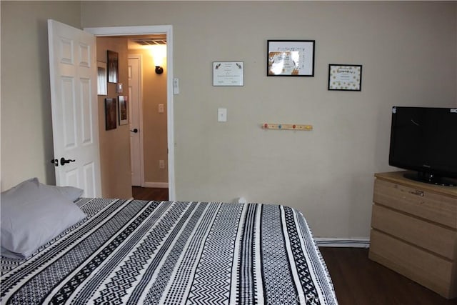 3820 Apache Ave, Bakersfield, CA 93309 - bedroom with dark wood-style flooring and baseboards