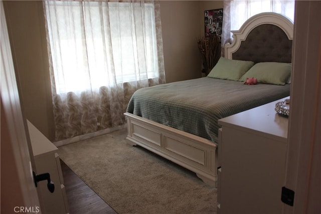 3820 Apache Ave, Bakersfield, CA 93309 - carpeted bedroom featuring multiple windows and baseboards