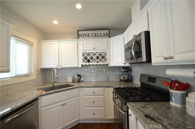 1641 1st St, La Verne, CA 91750 - kitchen with stainless steel appliances, a sink, white cabinetry, backsplash, and recessed lighting