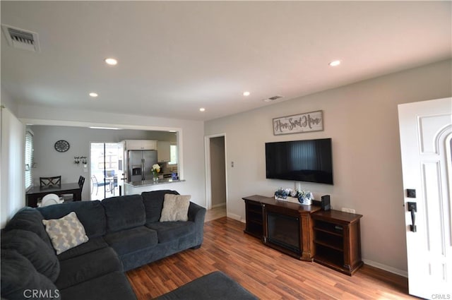1641 1st St, La Verne, CA 91750 - living room featuring recessed lighting, light wood-type flooring, and baseboards