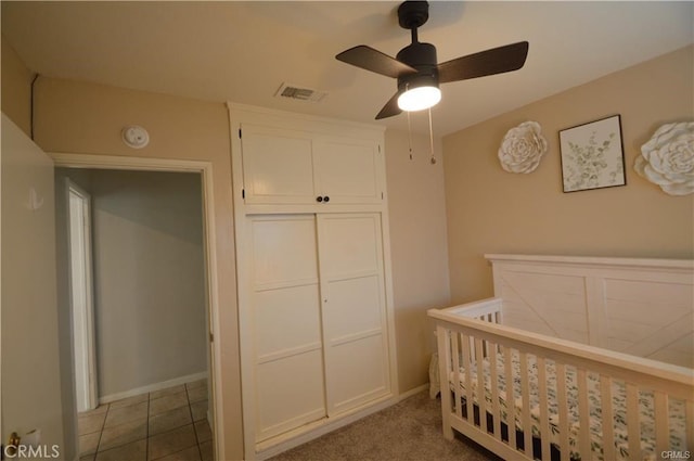 1641 1st St, La Verne, CA 91750 - bedroom featuring a crib, a closet, baseboards, and a ceiling fan