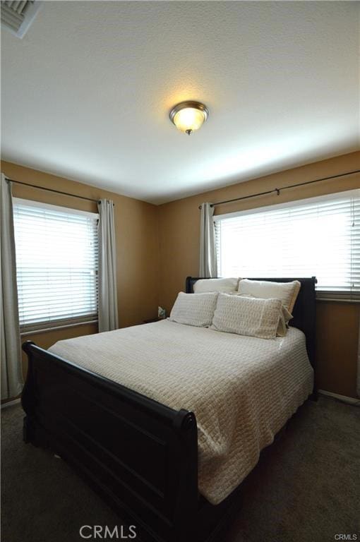 1641 1st St, La Verne, CA 91750 - bedroom with multiple windows and dark carpet