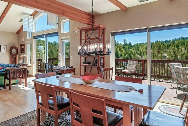 26855 Inyo Ct, Lake Arrowhead, CA 92352 - dining room featuring beam ceiling, wood finished floors, and a chandelier