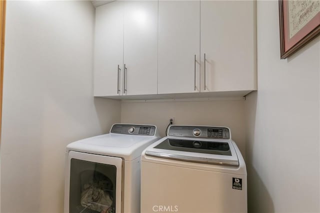 26855 Inyo Ct, Lake Arrowhead, CA 92352 - laundry room featuring washing machine and clothes dryer and cabinet space