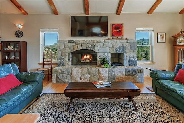 26855 Inyo Ct, Lake Arrowhead, CA 92352 - living area featuring a fireplace, wood finished floors, and beam ceiling