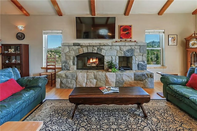 26855 Inyo Ct, Lake Arrowhead, CA 92352 - living area featuring a fireplace, wood finished floors, and beam ceiling