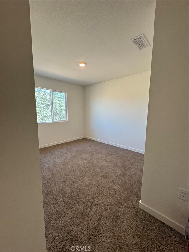 1147 Lentil Way, Chico, CA 95928 - empty room featuring dark carpet and baseboards