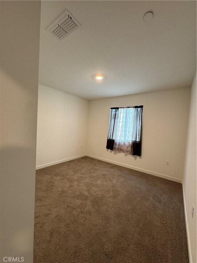 1147 Lentil Way, Chico, CA 95928 - unfurnished room with dark colored carpet and baseboards