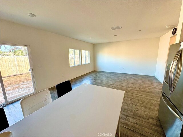 1147 Lentil Way, Chico, CA 95928 - unfurnished dining area with dark wood-style floors and baseboards