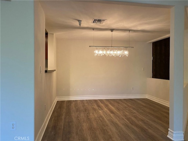 107 N Swall Dr Unit 304, Los Angeles, CA 90048 - spare room with dark wood finished floors, baseboards, and a chandelier
