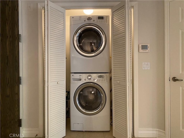 107 N Swall Dr Unit 304, Los Angeles, CA 90048 - laundry room featuring stacked washer and clothes dryer and light tile patterned floors