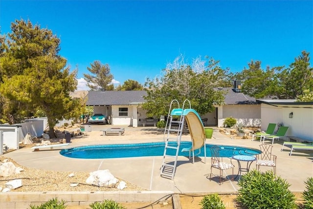 9124 Joshua Ln, Yucca Valley, CA 92284 - outdoor pool featuring a water slide, a patio area, and a diving board