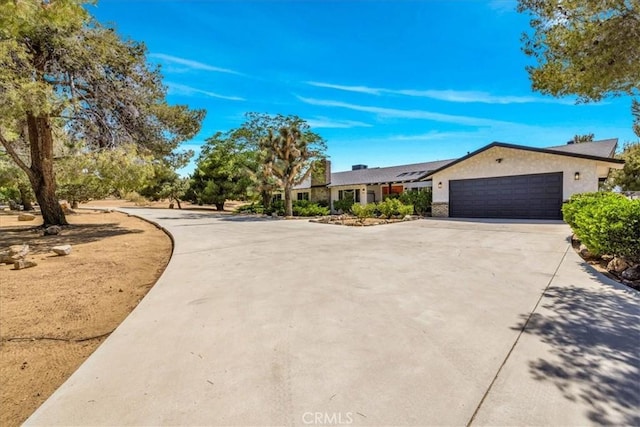 9124 Joshua Ln, Yucca Valley, CA 92284 - single story home with concrete driveway and an attached garage