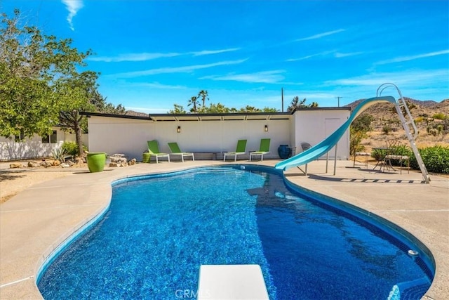 9124 Joshua Ln, Yucca Valley, CA 92284 - view of pool with a water slide, a diving board, and a patio area