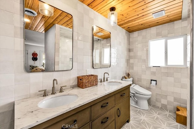 9124 Joshua Ln, Yucca Valley, CA 92284 - bathroom with tile walls, wood ceiling, double vanity, toilet, and decorative backsplash
