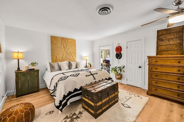 9124 Joshua Ln, Yucca Valley, CA 92284 - bedroom with light wood-type flooring and ceiling fan