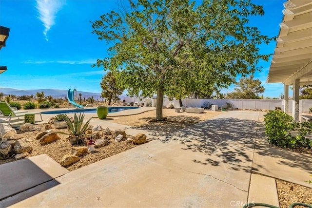 9124 Joshua Ln, Yucca Valley, CA 92284 - view of patio featuring a mountain view