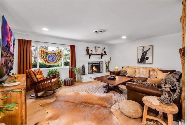 9124 Joshua Ln, Yucca Valley, CA 92284 - living area with wood finished floors, a brick fireplace, and recessed lighting