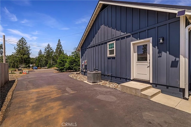 13654 Andover Dr, Magalia, CA 95954 - exterior space with board and batten siding and central AC unit