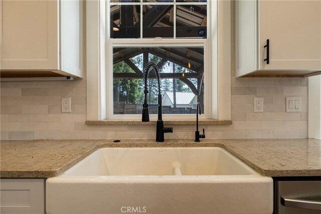 13654 Andover Dr, Magalia, CA 95954 - kitchen featuring a sink, white cabinets, tasteful backsplash, and light stone countertops