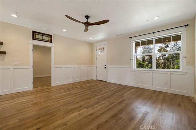 13654 Andover Dr, Magalia, CA 95954 - spare room featuring ceiling fan, wood finished floors, wainscoting, a decorative wall, and recessed lighting