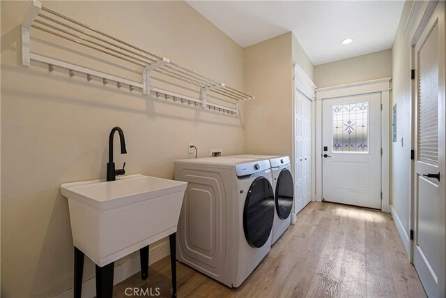 13654 Andover Dr, Magalia, CA 95954 - washroom featuring independent washer and dryer, light wood-style floors, recessed lighting, and baseboards