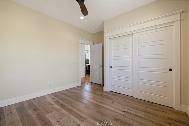 13654 Andover Dr, Magalia, CA 95954 - unfurnished bedroom with baseboards, wood finished floors, recessed lighting, a closet, and ceiling fan