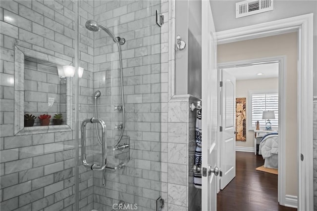 17652 Fiesta Way, Tustin, CA 92780 - bathroom with a shower stall, wood finished floors, and ensuite bathroom