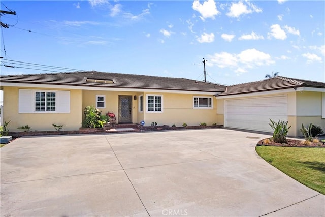 17652 Fiesta Way, Tustin, CA 92780 - ranch-style house featuring concrete driveway, stucco siding, a garage, and a tiled roof
