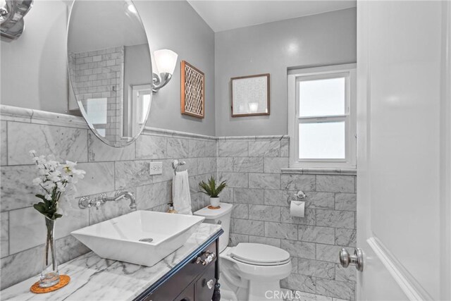 17652 Fiesta Way, Tustin, CA 92780 - bathroom with tile walls, vanity, and wainscoting