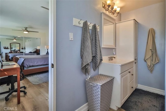 2230 Cordero Ave, Simi Valley, CA 93065 - ensuite bathroom with wood finished floors, vanity, a ceiling fan, and baseboards