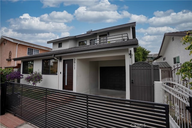2911 S Ridgeley Dr, Los Angeles, CA 90016 - view of front of home featuring stucco siding and a gate